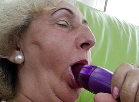 fullgrown grandma effectuation alongside a purple dildo